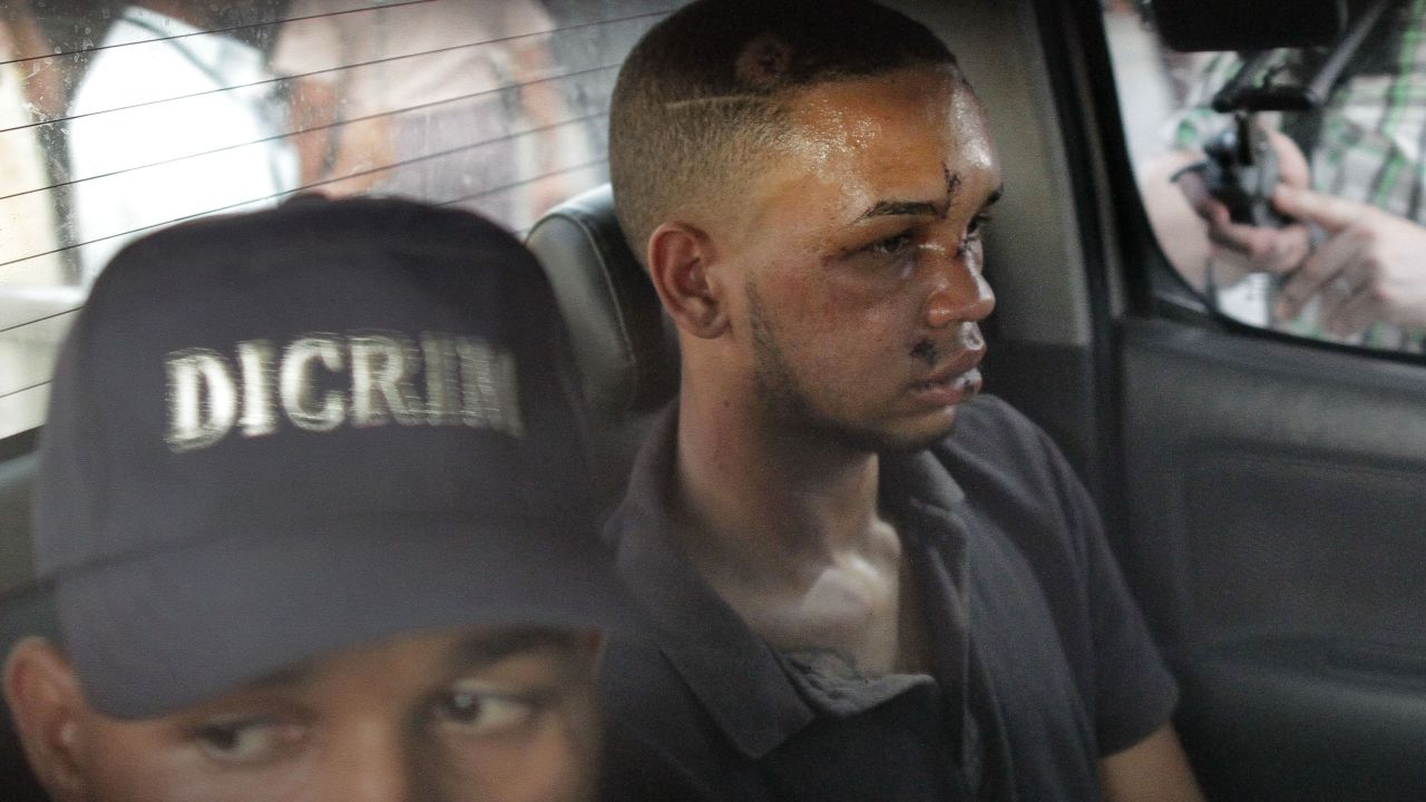 Suspect Eddy Vladimir Féliz Garcia is transported by police to court.