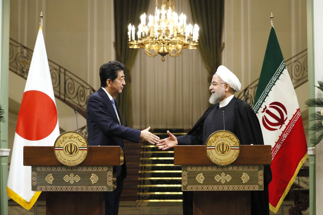 Japanese Prime Minister Shinzo Abe, left, and Iranian President Hassan Rouhani shake hands after a joint press conference in Tehran.