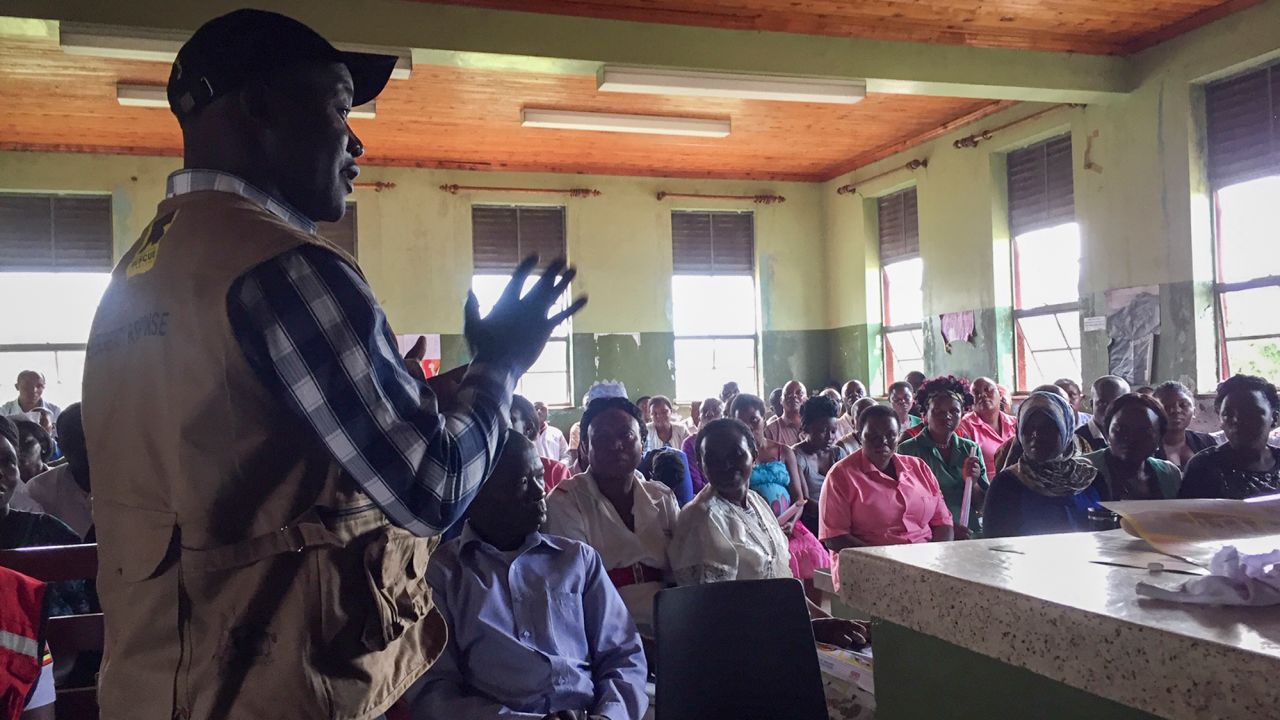 This photo released by the International Rescue Committee (IRC) shows hospital staff and others being briefed on how to keep themselves safe, at Bwera hospital where the confirmed and suspected cases of Ebola are being treated Wednesday, June 12, 2019 in Kasese District, western Uganda, near the border with Congo. 