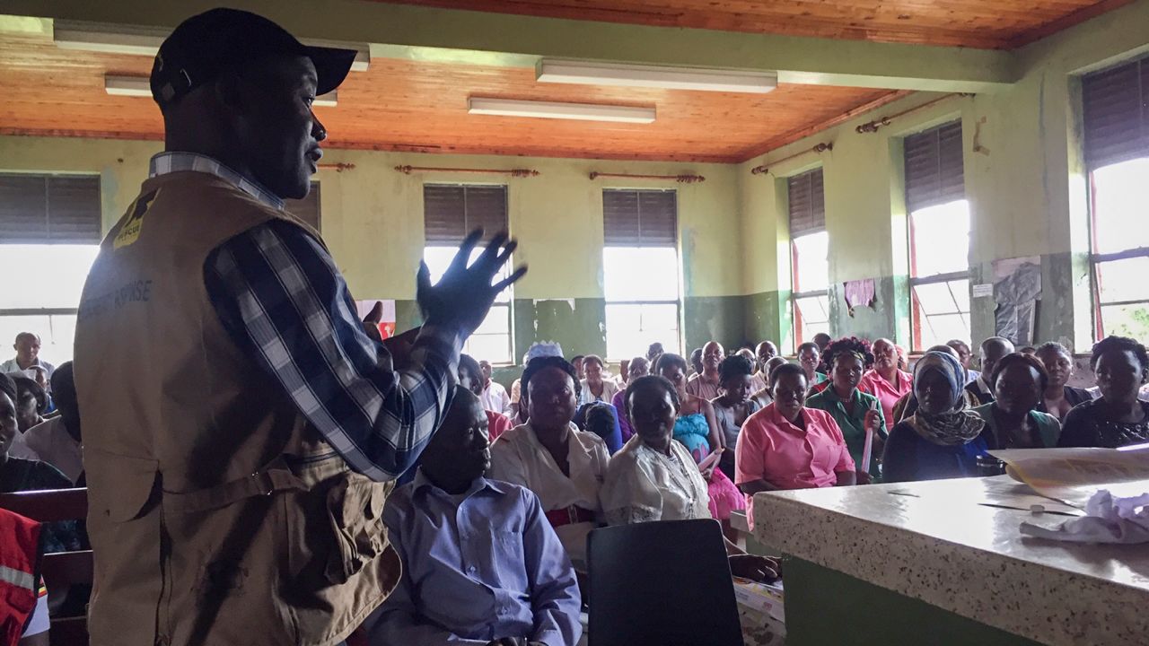 This photo released by the International Rescue Committee (IRC) shows hospital staff and others being briefed on how to keep themselves safe, at Bwera hospital where the confirmed and suspected cases of Ebola are being treated Wednesday, June 12, 2019 in Kasese District, western Uganda, near the border with Congo.