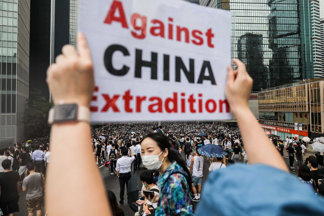 A demonstrator holds a sign during the June 12 rally.