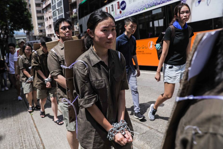 Students wear chains during a demonstration on Saturday, June 8.