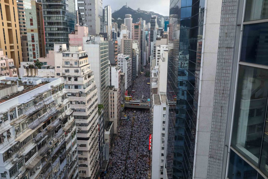 Protesters march during a rally against a controversial extradition law proposal in Hong Kong on June 9, 2019. (Photo by DALE DE LA REY / AFP) 