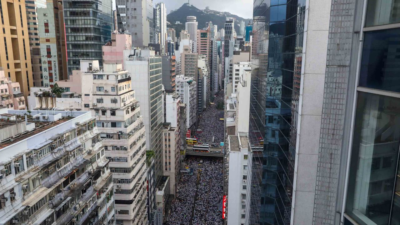 Protesters march during a rally against a controversial extradition law proposal in Hong Kong on June 9, 2019. (Photo by DALE DE LA REY / AFP) 