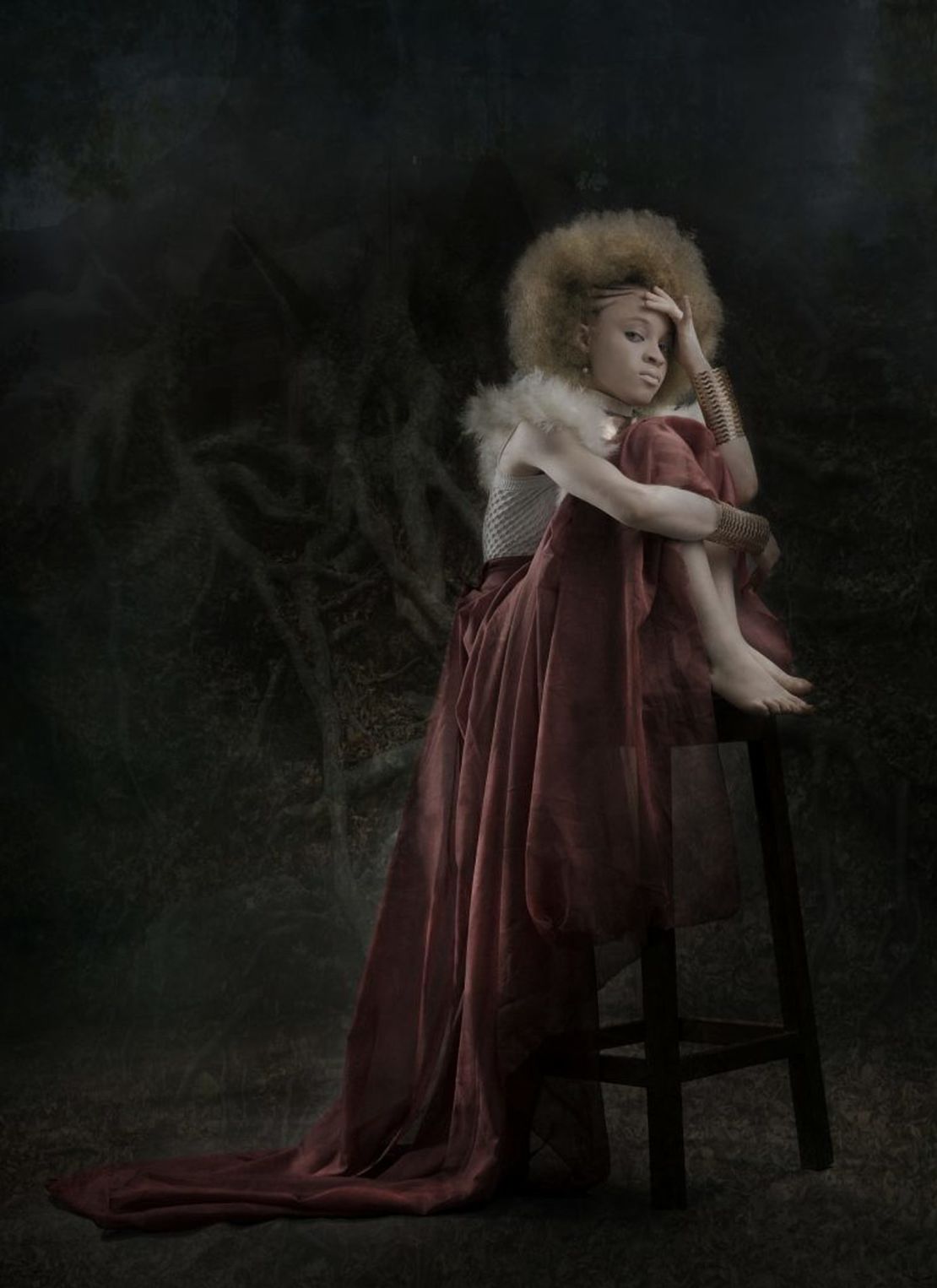 Efemena Ewhero is photographed in the dark here to depict how persons with albinism are often left wondering in the dark why people misjudge them based on their skin.