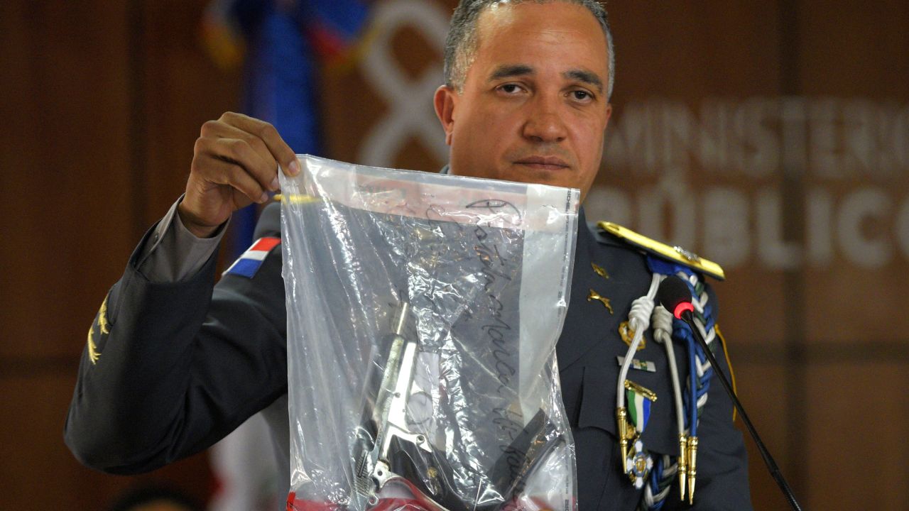 Dominican National Police Director Ney Aldrin Bautista Almonte show the gun used in the shooting of former Boston Red Sox star David Ortiz on Wednesday.