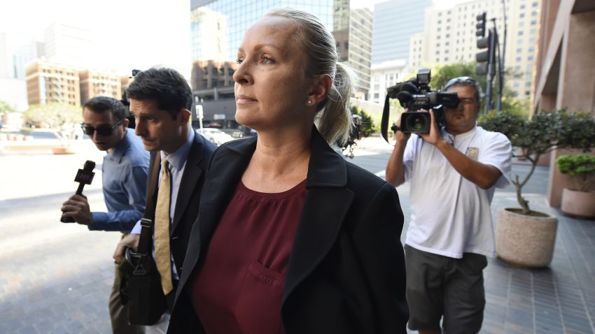 Margaret Hunter, center, the wife of U.S. Rep. Duncan Hunter, arrives for an arraignment hearing Thursday, Aug. 23, 2018, in San Diego. Hunter and his wife were indicted this week on federal charges that they used more than $250,000 in campaign funds for personal expenses that ranged from groceries to golf trips and lied about it in federal filings, prosecutors said. (AP Photo/Denis Poroy)