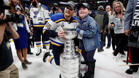 Colton Parayko of the St. Louis Blues and Laila Anderson celebrate with the Stanley Cup.