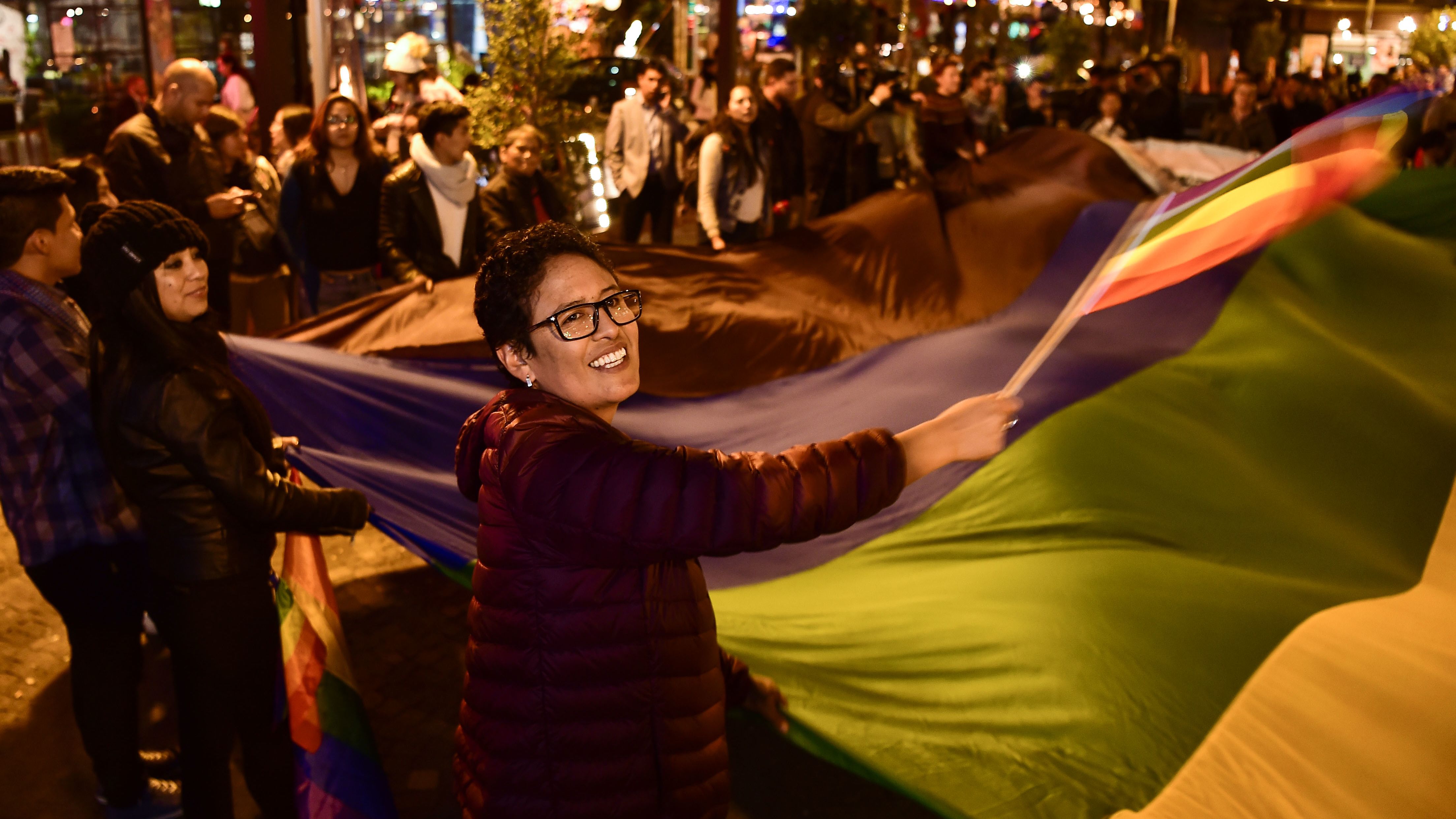LGBTQ activists in Quito celebrate the court's decision, which ruled in favor of same-sex marriage.