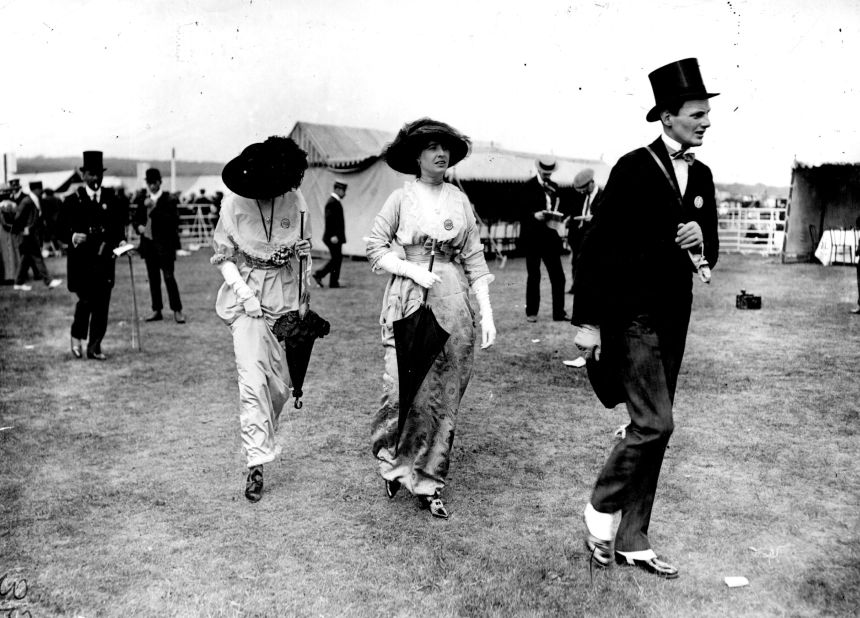 Spectators wear formal attire in 1913. 
