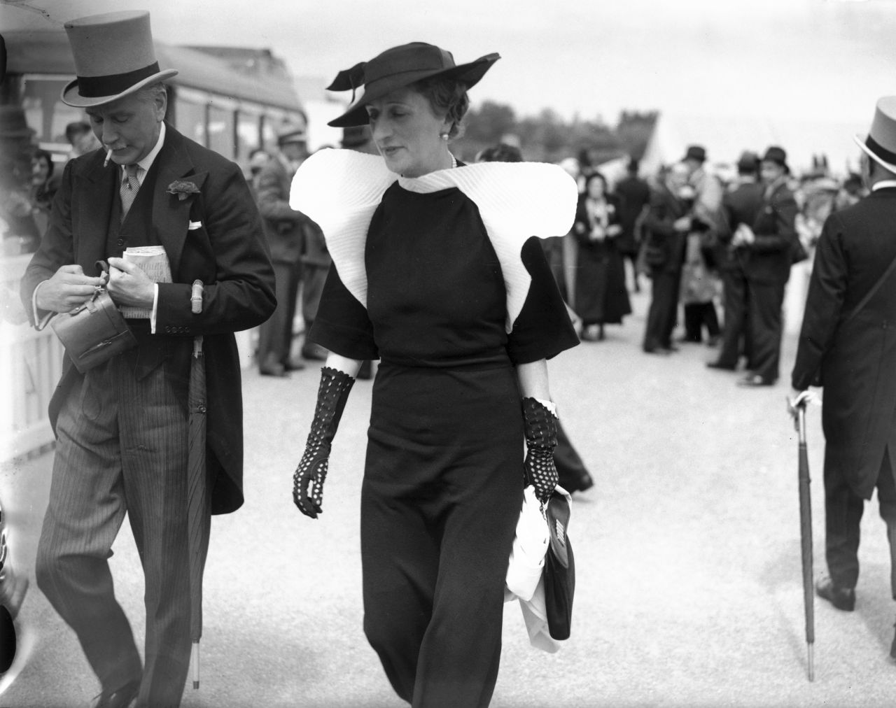 This woman wearing a black trouser suit to the 1936 Royal Ascot races was truly ahead of her time: Trouser suits weren't officially recognized as Ascot-appropriate until the 1970s.