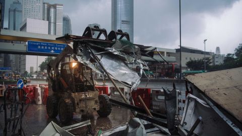 A worker cleans the debris with a bulldozer in Central district the day after the police's clearance on June 13, 2019 in Hong Kong.