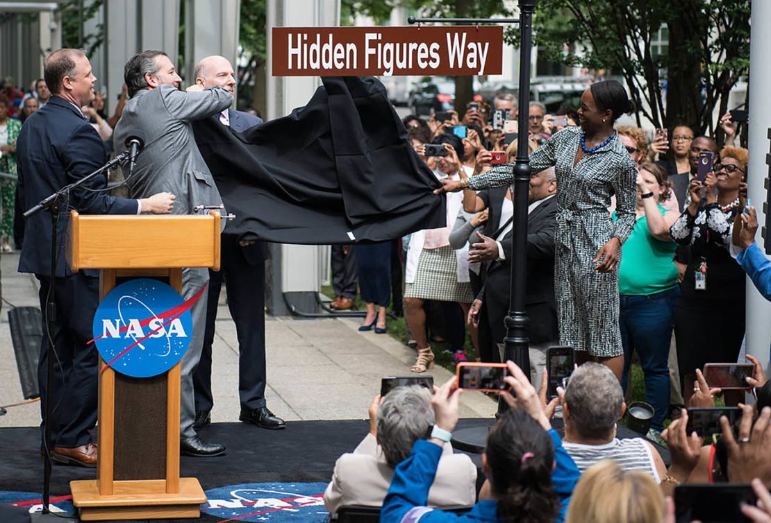 The Hidden Figures Way street sign is unveiled at a dedication ceremony Wednesday at NASA headquarters in Washington.