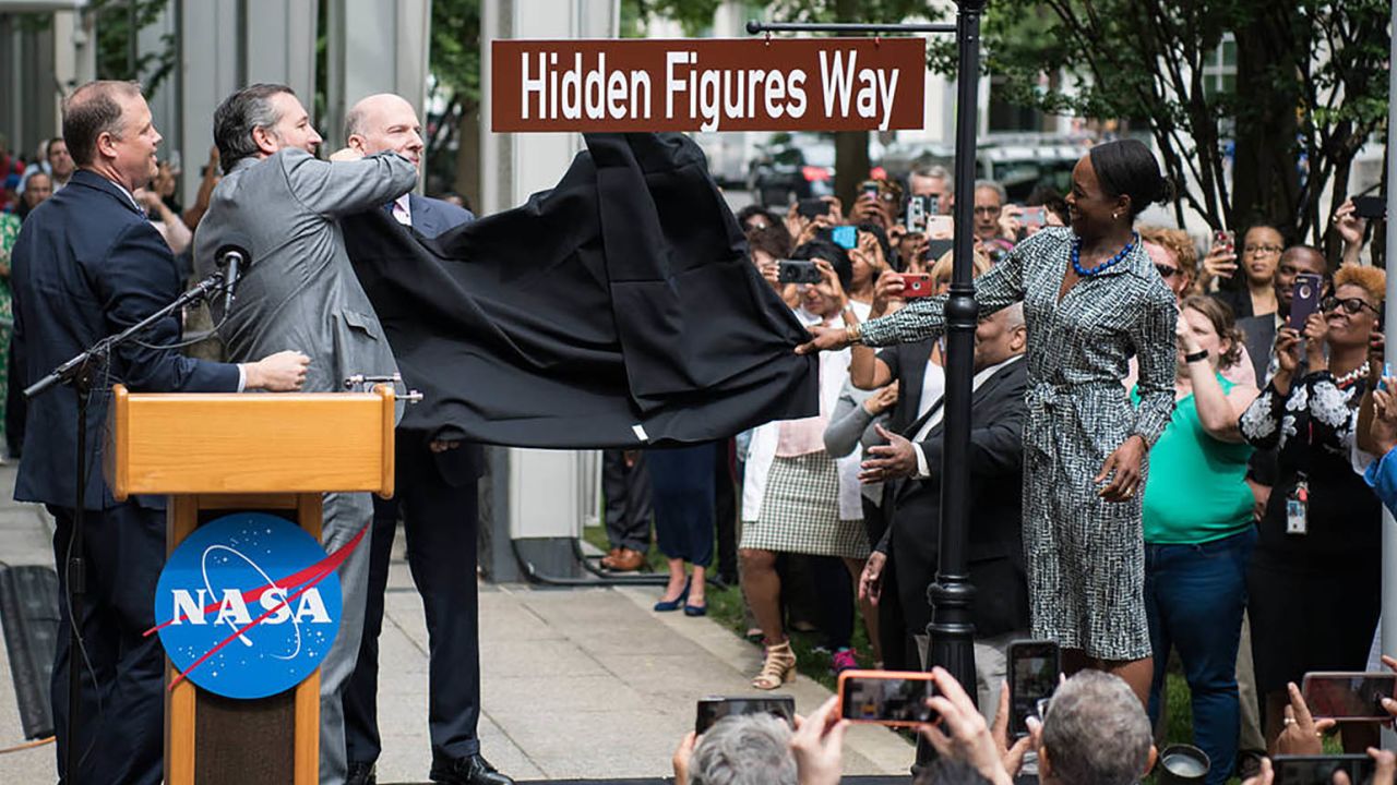 The Hidden Figures Way street sign is unveiled at a dedication ceremony Wednesday at NASA headquarters in Washington.