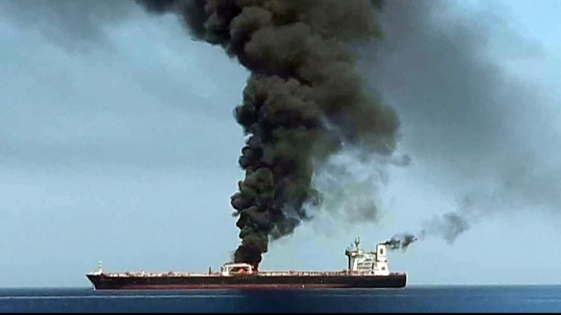 Smoke billowing from a tanker said to have been attacked off the coast of Oman. CNN has not independently verified this image.