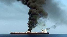 Obtained by AFP from Iranian State TV IRIB reportedly shows smoke billowing from a tanker said to have been attacked off the coast of Oman, at an undisclosed location. CNN has not independently verified this image.