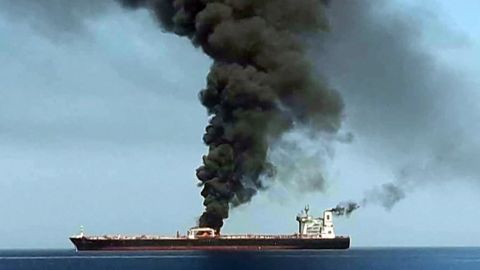 This still, obtained by AFP from Iranian State TV IRIB, purports to show smoke billowing from a tanker said to have been attacked off Oman. CNN has not independently verified this image.