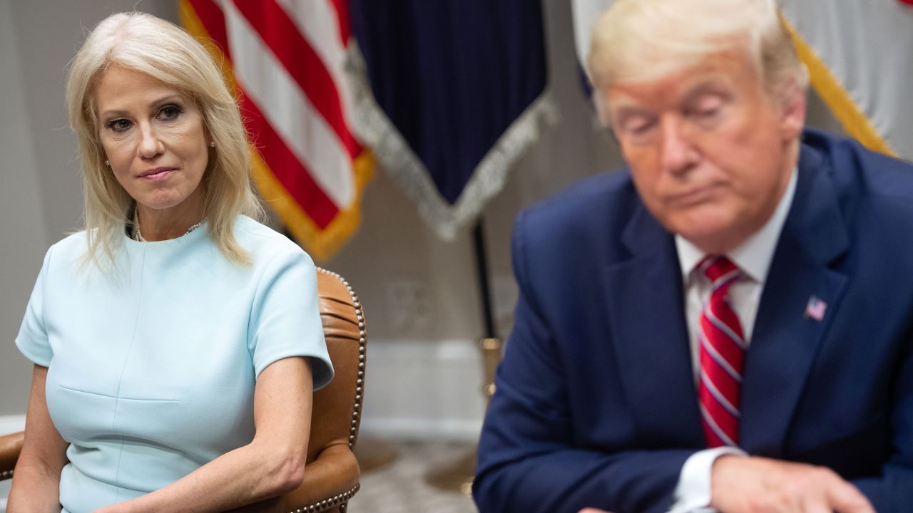 US President Donald Trump sits alongside Kellyanne Conway (L), Counselor to the President, during a meeting on the opioid epidemic in the Roosevelt Room of the White House in Washington, DC, June 12, 2019.