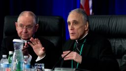 Cardinal Daniel DiNardo of the Archdiocese of Galveston-Houston, right, president of the United States Conference of Catholic Bishops, accompanied by Jose Gomez, archbishop of Los Angeles, speaks to the bishops before the morning prayer during the United States Conference of Catholic Bishops (USCCB), 2019 Spring meetings in Baltimore,  Tuesday, Jun 11, 2019. (AP Photo/Jose Luis Magana)