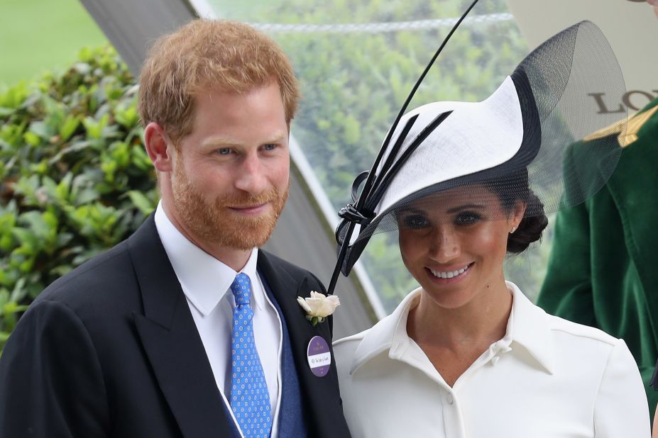 Prince Harry, Duke of Sussex, and Meghan, Duchess of Sussex, attend a prize ceremony at Royal Ascot in 2018.