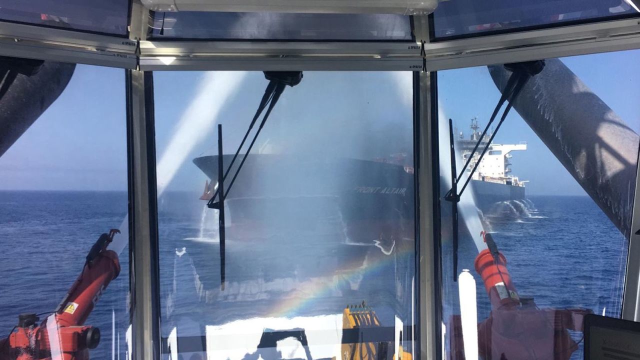 In this photo from Frontline, the owner of the crude oil tanker "Front Altair" firefighters work to entinguish the blaze aboard the ship in the Gulf of Oman on Thursday.