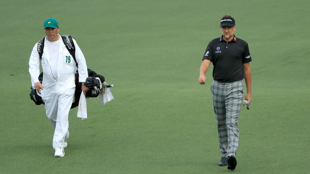 Mundy (left) wearing Augusta's traditional jumpsuit while working for Ian Poulter at the Masters.