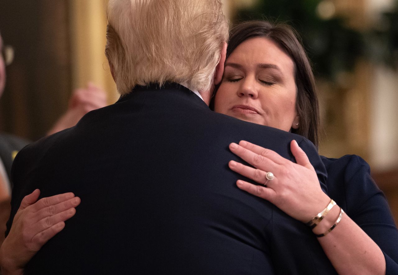 Outgoing White House Press Secretary Sarah Sanders hugs President Donald Trump in the East Room of the White House in Washington, DC on Wednesday, June 13. 