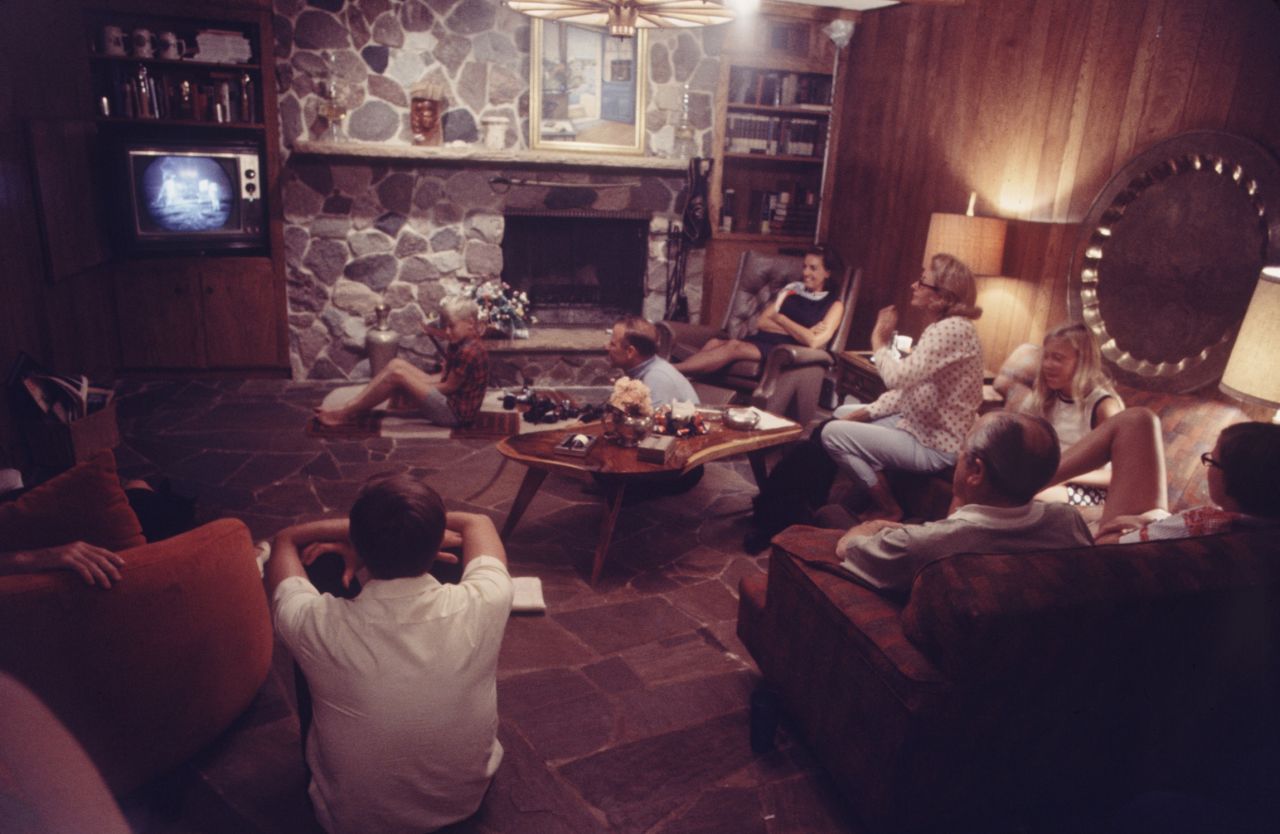 Aldrin's family and friends watch the mission from his home in Texas. Aldrin's wife, Joan, is in the polka-dot shirt. ABC, CBS and NBC spent between $11 million and $12 million to cover the mission from July 20-21.