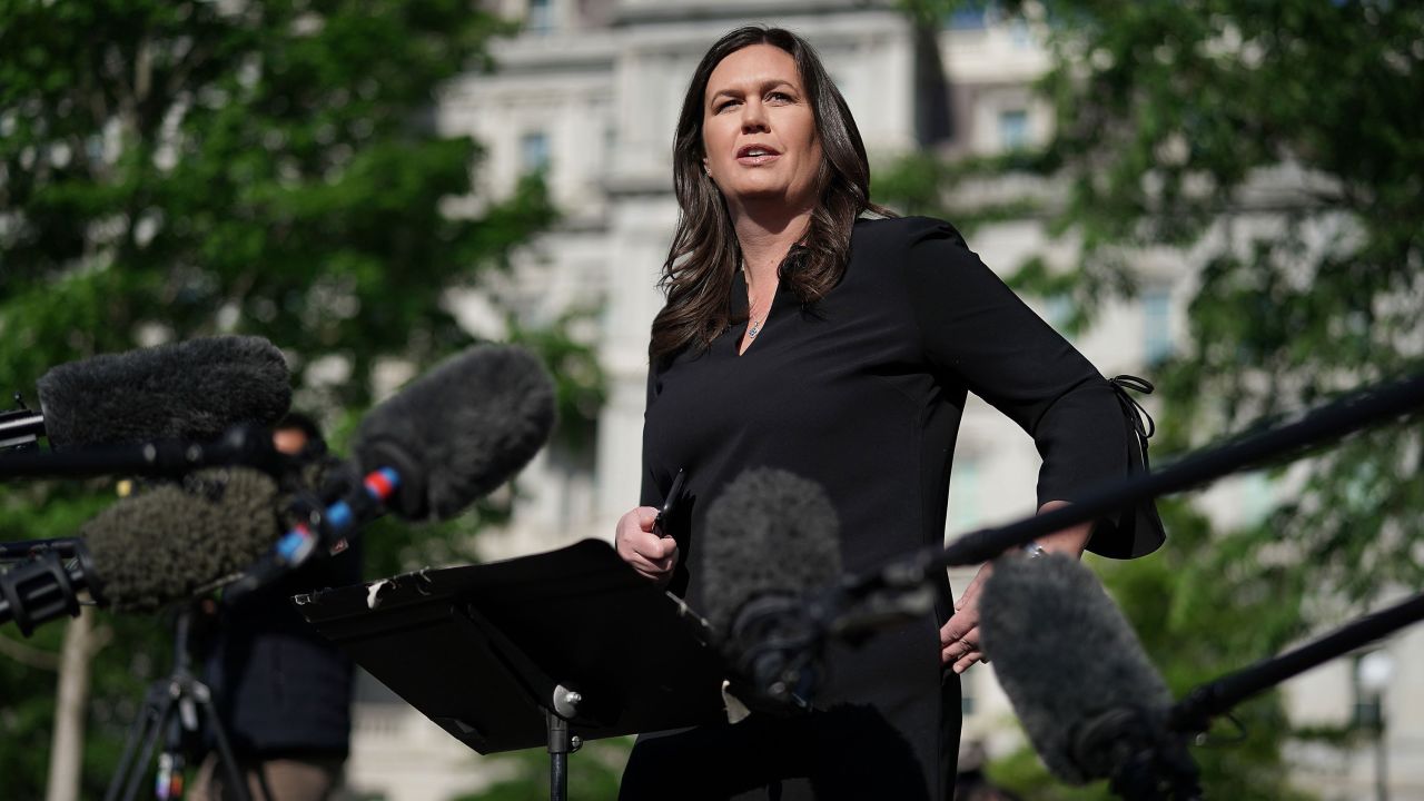 Sanders talks to reporters after being interviewed on Fox News outside the White House April 29, in Washington, DC. In lieu of regular press briefings inside the White House, Sanders regularly stops to talk to reporters after being interviewed by "Fox and Friends."