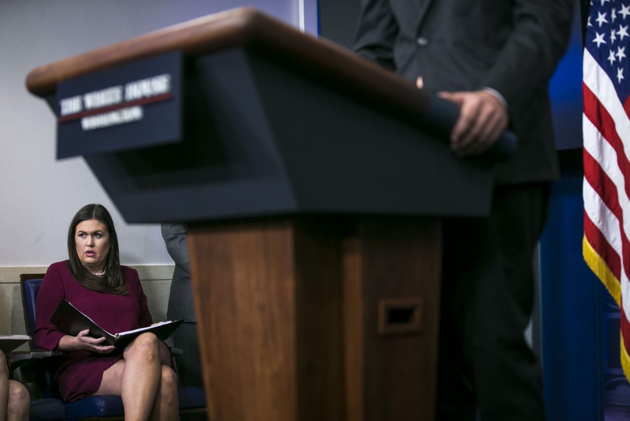Sanders looks on as Homeland Security Adviser Tom Bossert speaks at the daily briefing at the White House on Thursday, August 31, 2017. On Thursday, Sanders said President Donald Trump would donate $1 million in personal money to Hurricane Harvey storm relief efforts.