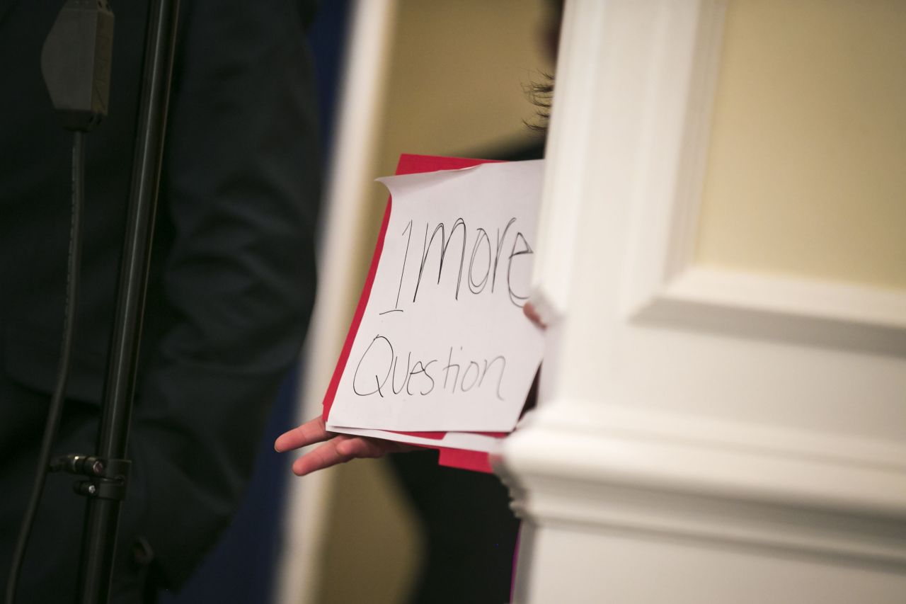 Sanders holds up a sign signaling one more question as President Donald Trump speaks to reporters after a security briefing with members of his national security team at Trump National Golf Club in Bedminster, New Jersey, on Thursday, August 10, 2017. Earlier on Thursday, Trump refused to back down from his threat to rain down "fire and fury" on North Korea if it endangers the United States, despite bipartisan criticism -- and he argued that perhaps he was not tough enough.