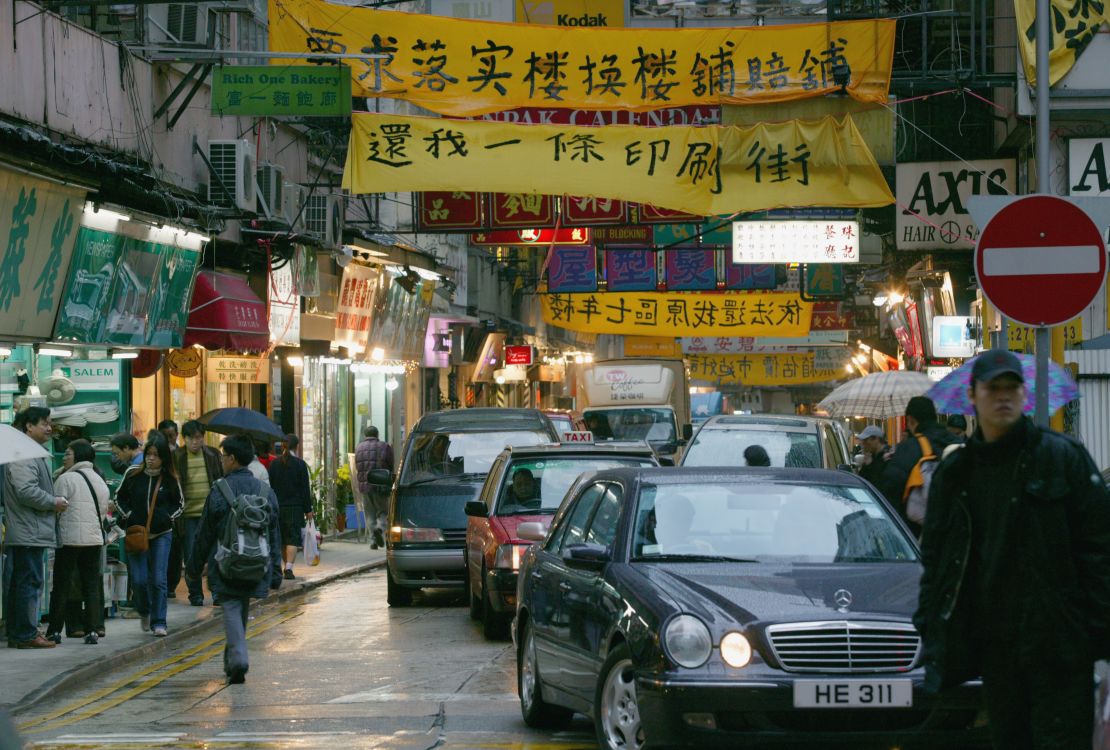 Banners on Lee Tung Street protest the redevelopment of the road known for being home to wedding banquet invitation card printers in February 2004. 
