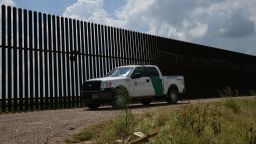 A US Border Patrol vehicle drives along a section of border fence near the US-Mexico border on June 12, 2019, in Hidalgo, Texas. (Photo by Loren ELLIOTT / AFP)        (Photo credit should read LOREN ELLIOTT/AFP/Getty Images)