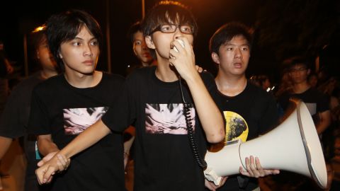 Leader of the student group "Scholarism," Joshua Wong  speaks to tens of thousands protesters outside the government headquarters in Hong Kong, in September 2012. 
