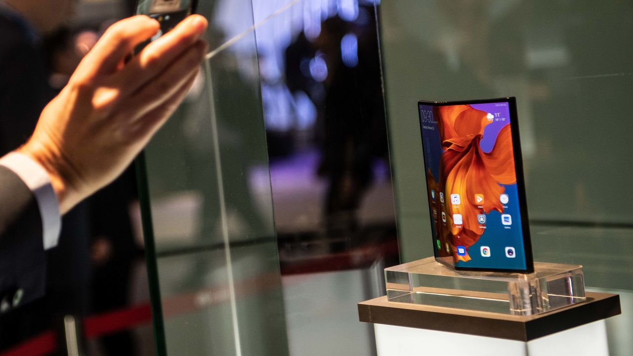 BARCELONA, SPAIN - FEBRUARY 26: A visitor take a picture to new Huawei Mate X at the Huawei booth on day 2 of the GSMA Mobile World Congress 2019 on February 26, 2019 in Barcelona, Spain. The annual Mobile World Congress hosts some of the world's largest communications companies, with many unveiling their latest phones and wearables gadgets like foldable screens and the introduction of the 5G wireless networks. (Photo by David Ramos/Getty Images)