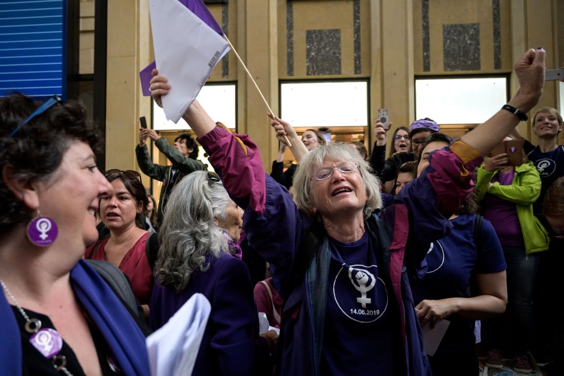 Women strike for wage parity at the Lausanne railway station during a day of mass demonstrations across Switzerland on Friday.