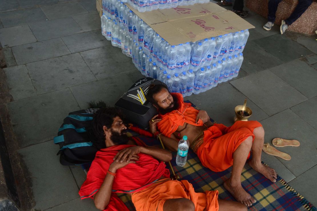 Passengers rest near water bottles at Allahabad railway station in Uttar Pradesh, India on June 11, 2019.  