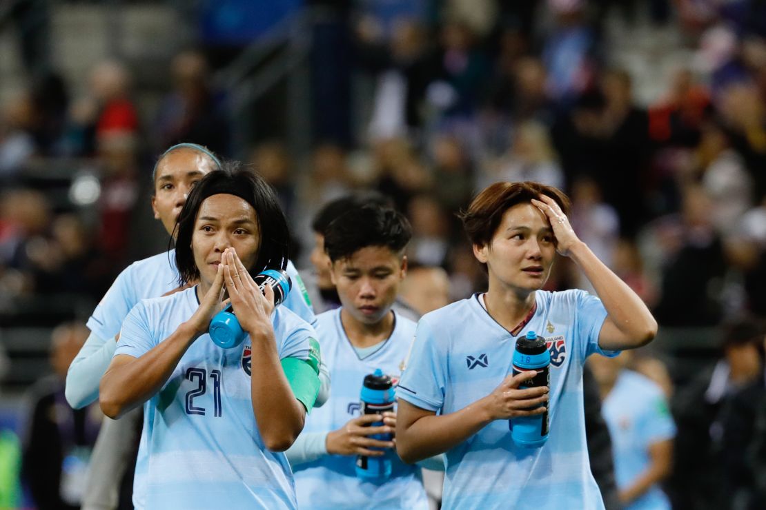 Thailand's players react after losing against the USA.