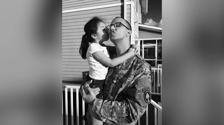 Jenny Lee Maldonado hugs her dad Ferdi who is deployed away from his family on Father's Day.  