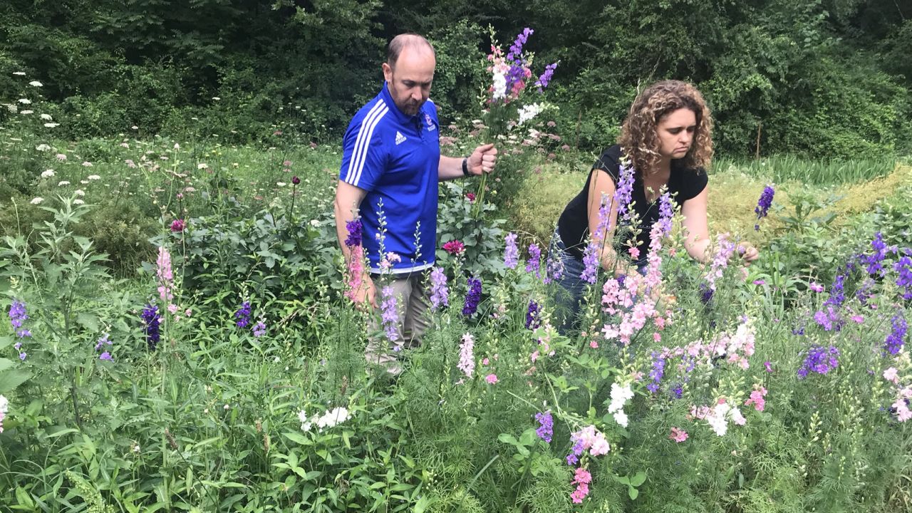 Amanda Pritchard picks flowers with her husband Bob on their farm in Tennessee.