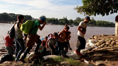 Migrants and residents use a makeshift raft to illegally cross the Suchiate river, from Tecun Uman, in Guatemala to Ciudad Hidalgo, Chiapas state, Mexico on June 14, 2019. - Mexico's Foreign Minister Marcelo Ebrard said Mexico will discuss a "safe third country" agreement with the US -- in which migrants entering Mexican territory must apply for asylum there rather than in the US -- if the flow of undocumented immigrants continues. (Photo by QUETZALLI BLANCO / AFP)        (Photo credit should read QUETZALLI BLANCO/AFP/Getty Images)