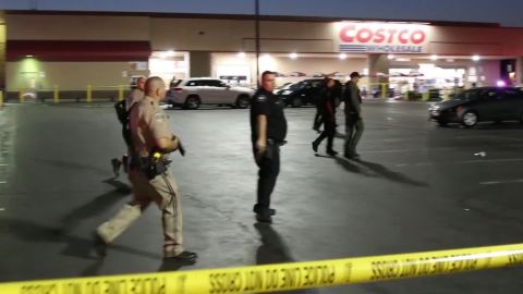 Police investigate the shooting at a California Costco in June.