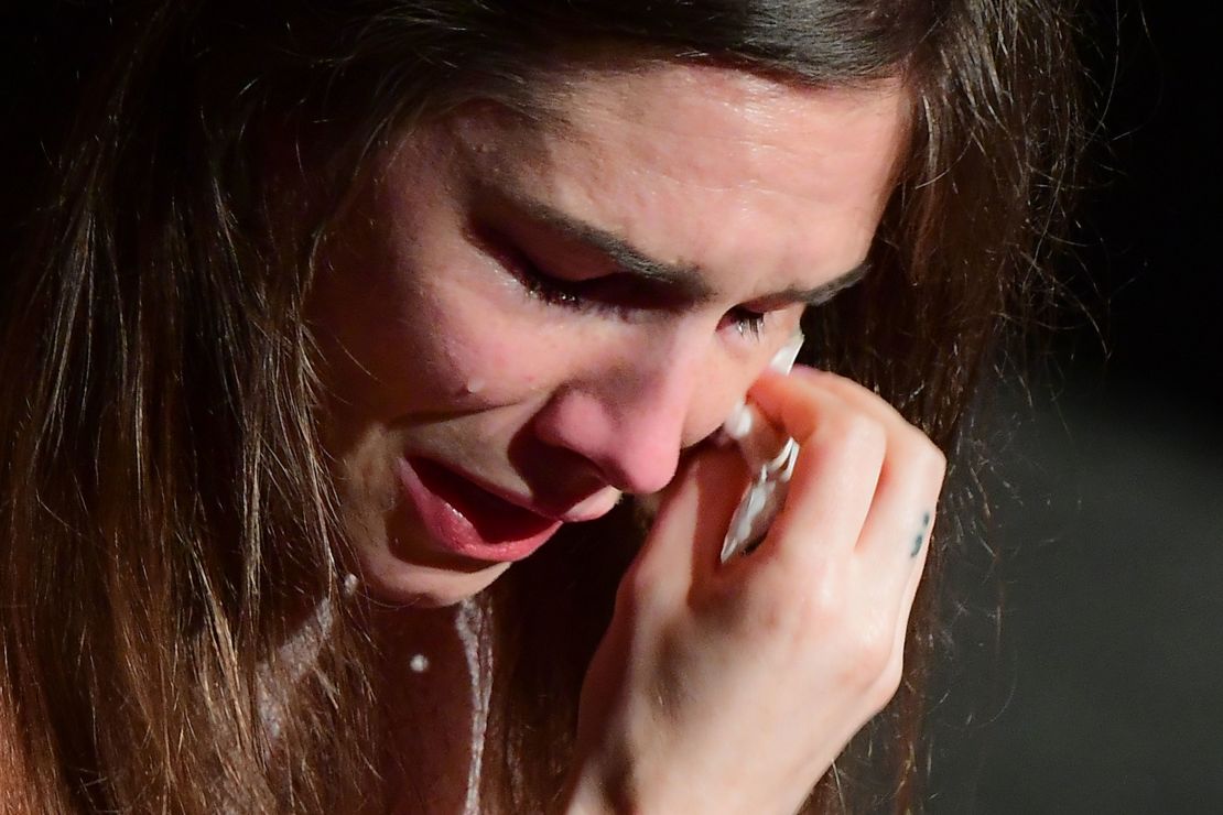 Amanda Knox wipes her tears away during her speech in Modena on Saturday. 