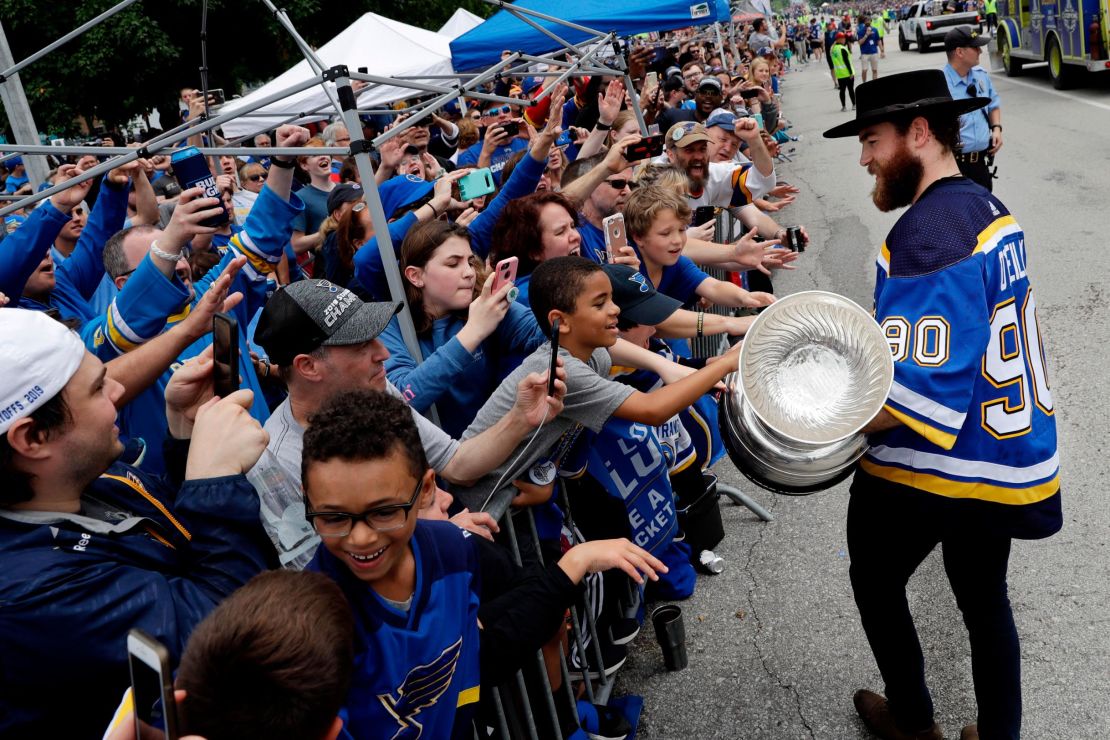 St. Louis Blues center Ryan O'Reilly carries the Stanley Cup during the Blues' NHL hockey Stanley Cup victory celebration in St. Louis on Saturday, June 15, 2019. (AP Photo/Darron Cummings)