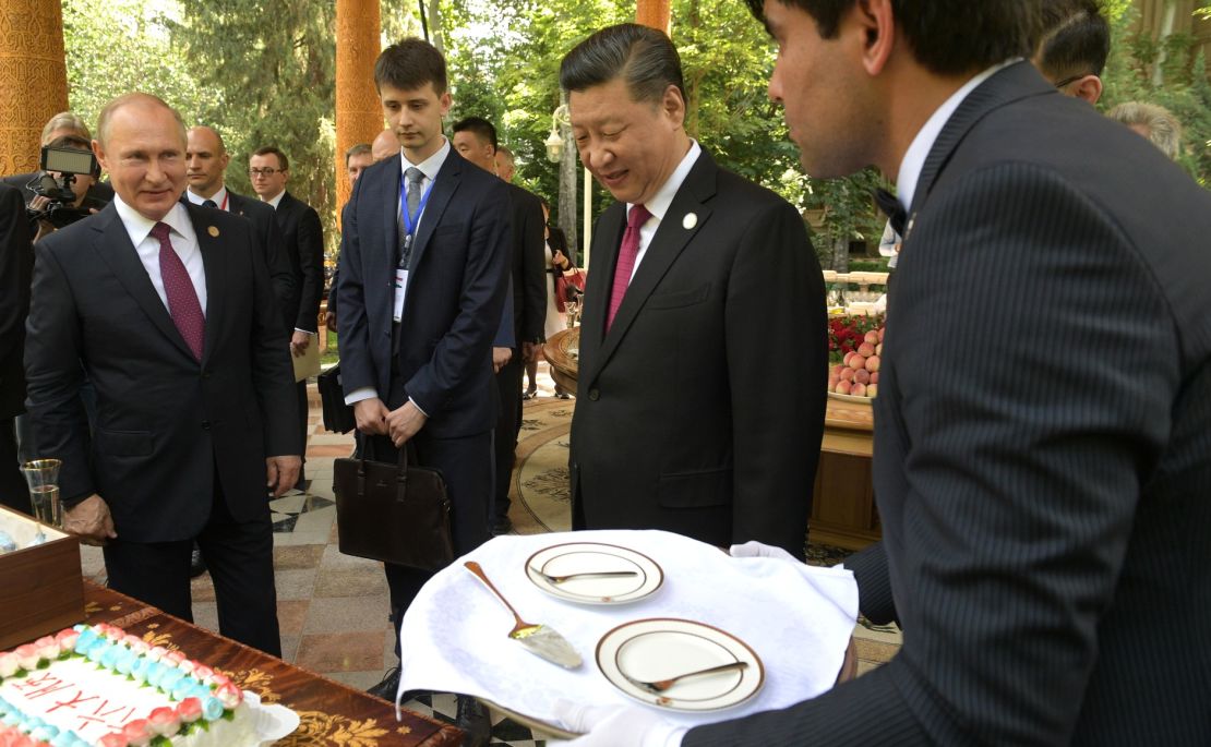 Putin presents Xi with ice cream on his 66th birthday.