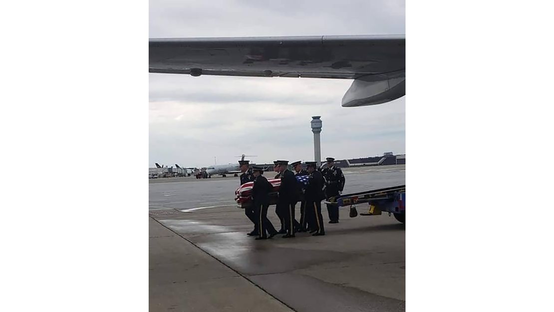 Lord's casket is carried off the plane in Cleveland on the way to his hometown in northeast Ohio.