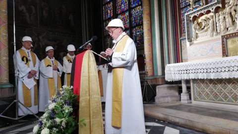 Patrick Chauvet, the rector of Notre Dame Cathedral, delivers an address during the Mass.