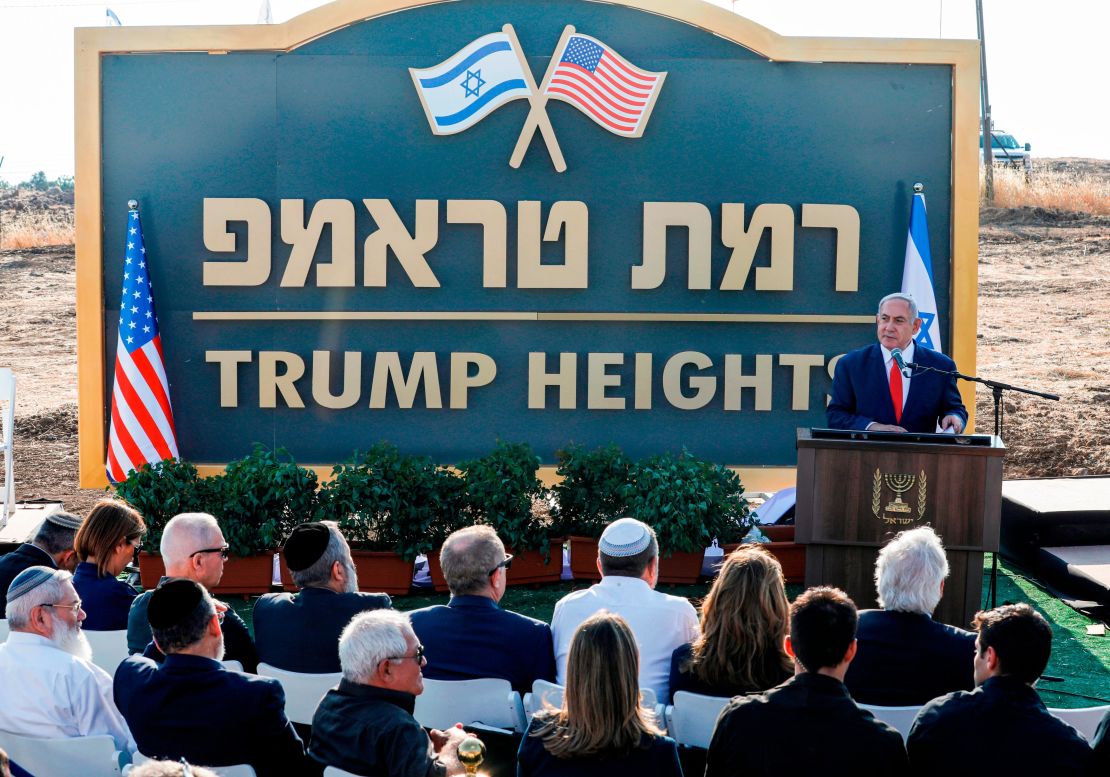 Netanyahu gives a speech before a sign for the new settlement of "Ramat Trump", or "Trump Heights" in English, during a ceremony in the Golan Heights on June 16, 2019.