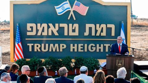 Netanyahu gives a speech before a sign for the new settlement of "Ramat Trump", or "Trump Heights" in English, during a ceremony in the Golan Heights on June 16, 2019.