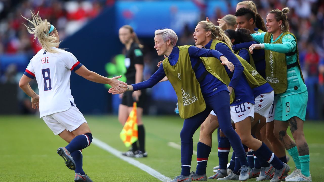 Julie Ertz celebrates with her teammates after scoring her team's second goal.